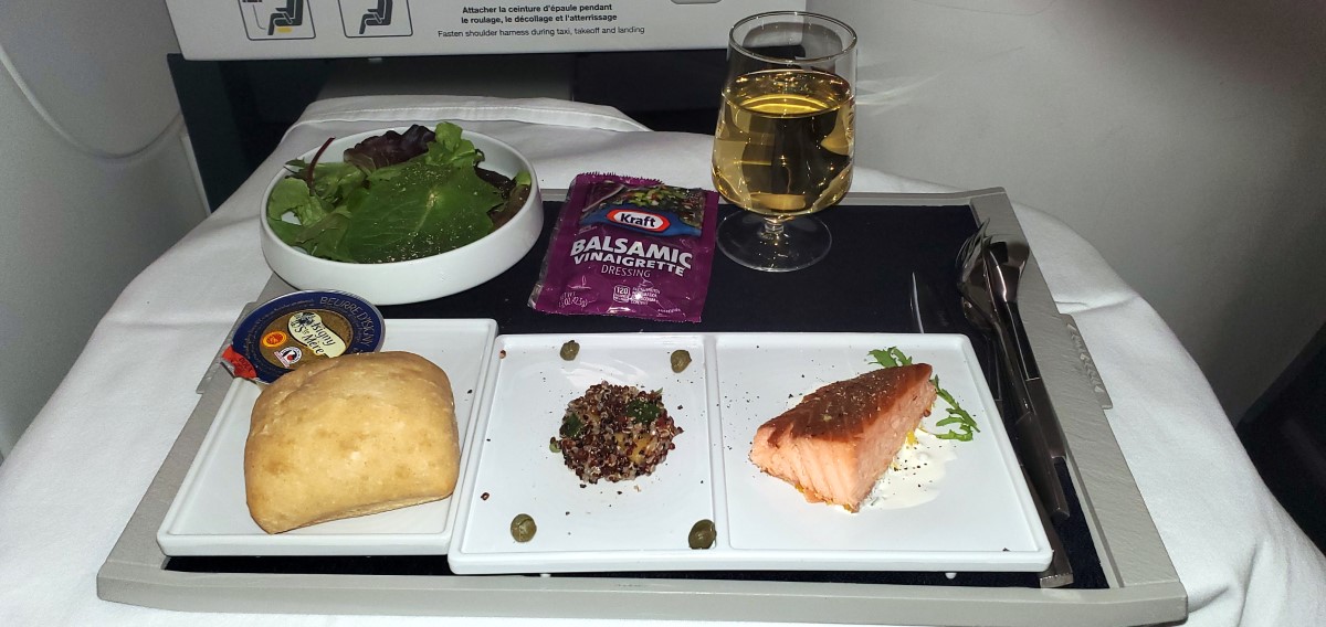 Amy had convinced me to fly First Class. On the way over on Air France, this was the starter course - Hot-smoked salmon, chive,cream and quinoa salad. And a fancy dressing for the salad.