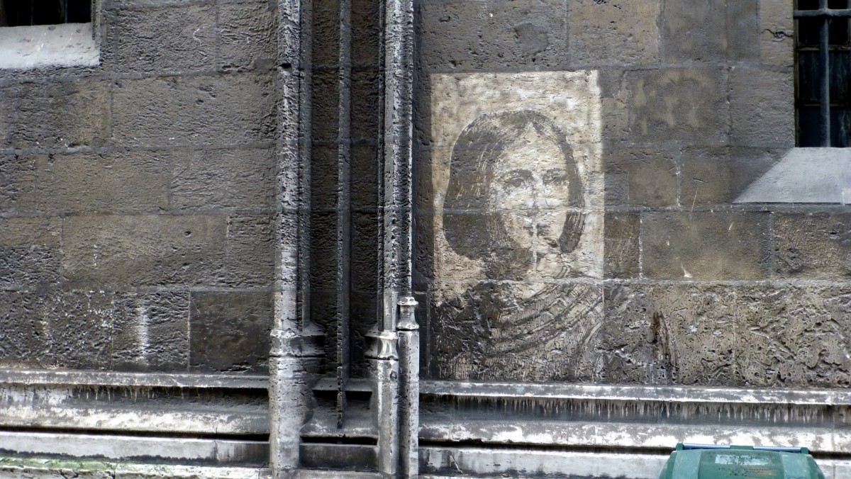 This portrait of St Jeanne D'Arc was created by the local art school by sandblasting the stone through a template.