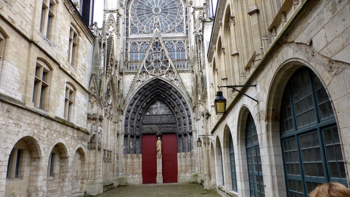 We entered the West Transept of the Cathedral through the Portail des Librairies. The statue standing guard over the portal is that of Saint Romain.