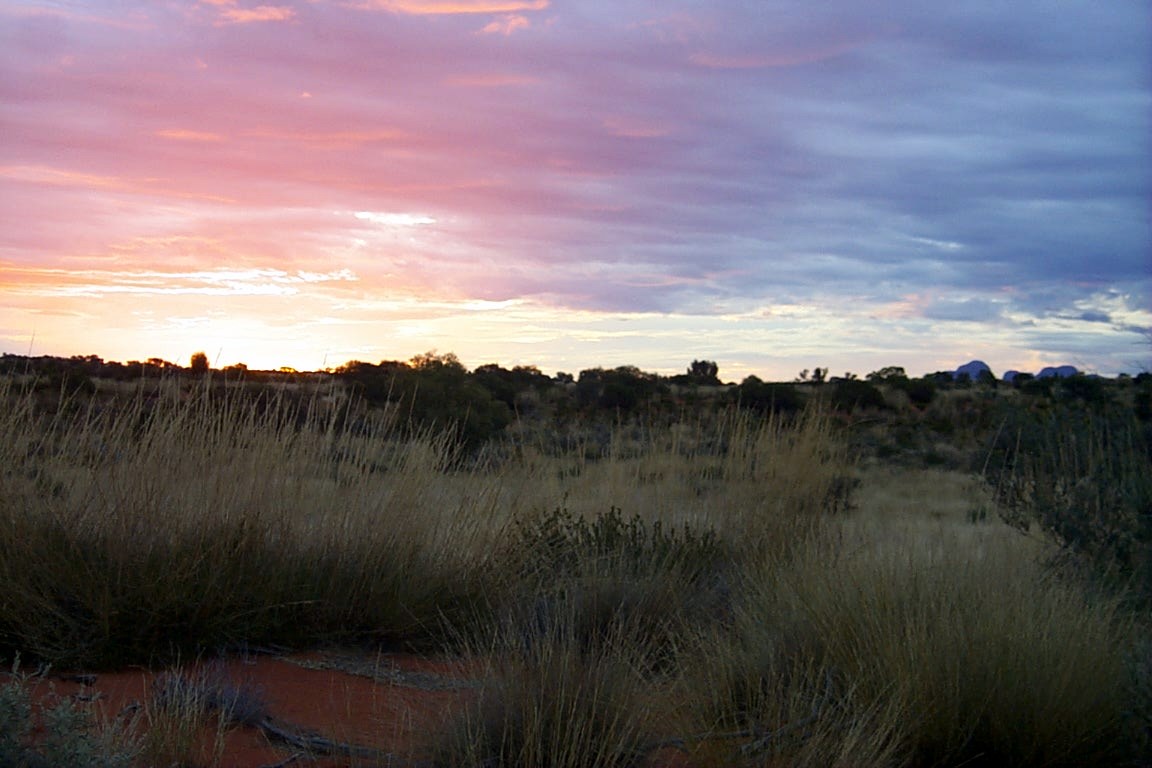 Sunset from Uluru with the Kata Tjutas in the background (upper right on the horizon)