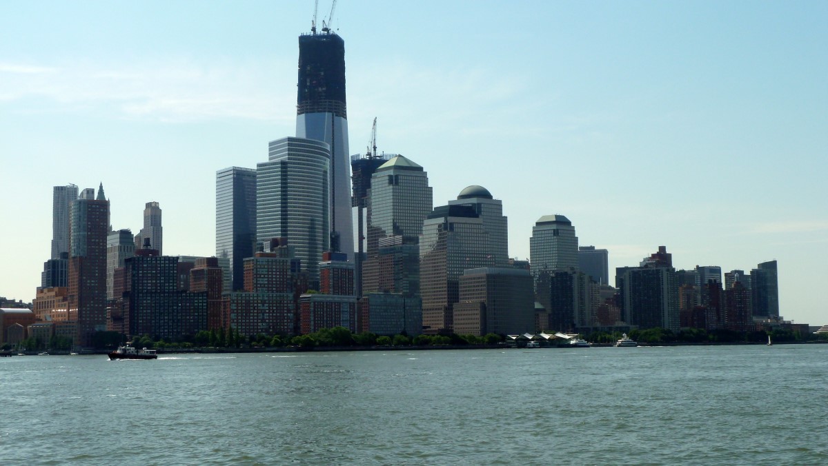 Looking to Lower Manhattan,the tall building under construction is the 1 World Trade Center, now the tallest building in NYC. It is the home of Wall Street and former home of the Twin Towers (World Trade Center). (We were just about on top of the Holland and Lincoln Tunnels when this picture was taken.)