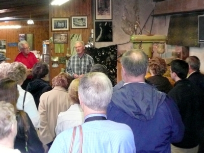 A lecture on Cannemara Marble. Note the samples to the left of the speaker and in the right edge of the picture.