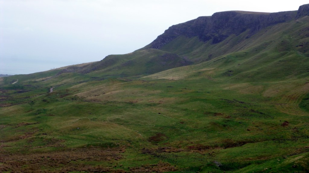 The location of the scene from Game of Thrones. It takes place on the hillock below the cliff near the center of the photo