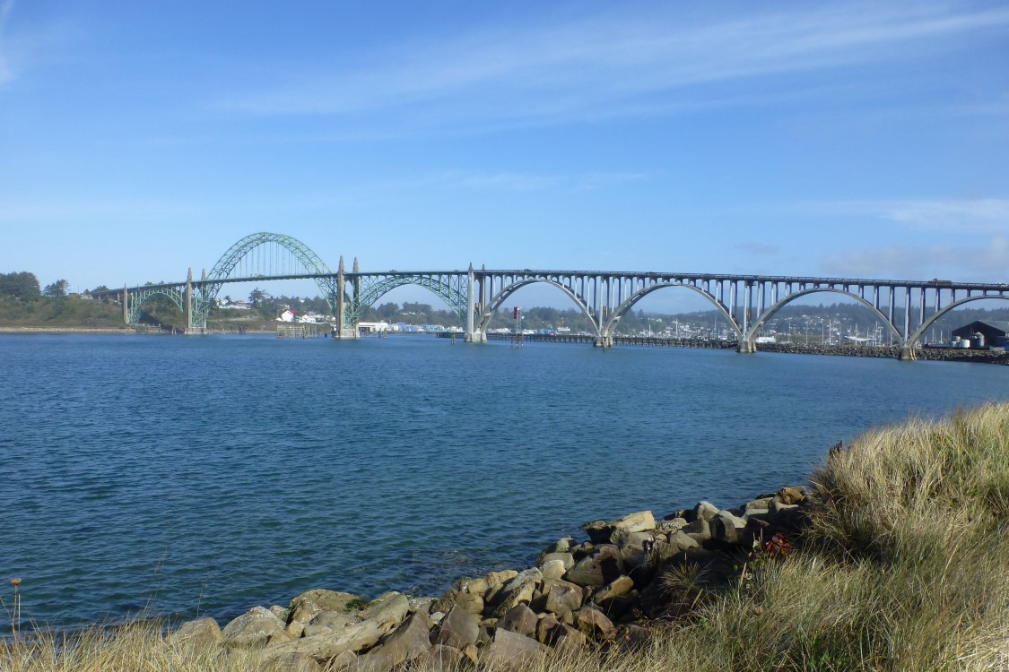 The Yaquina Bay Bridge was designed by Conde McCullough and constructed in the 1930s. The 600 foot main span rises 246 feet above sea level. Check out that blue sky!