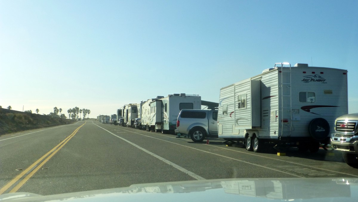 Fifth wheel trailers parked overlooking the beach.