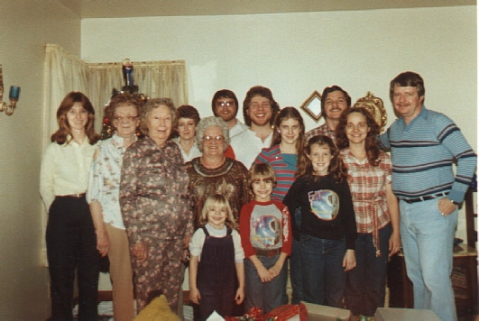 Sue, Aunt Mae, Aunt Francis, Delores, Momma, Frank, John, Glenda, Bennet, Me, (front row) Tricia, Jeff, and Amy (c. 1981)