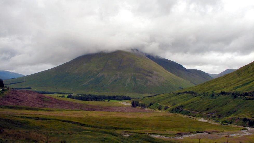 Passing through the Trossachs, I see a railroad running along the base of the mountains