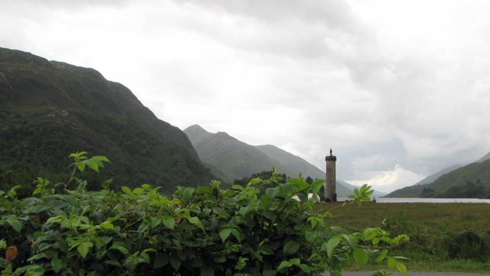 The Memorial with the mountain, Sgùrr Ghiubhsachain, in the distance to the left.