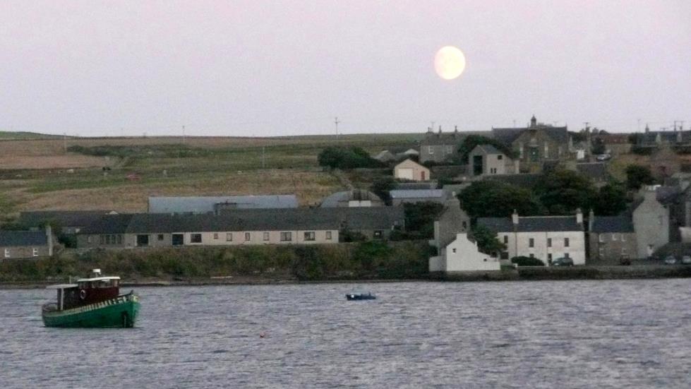 After taking the sunset picture at St. Margaret's Hope, on the port rail I found the waxing near full Moon.