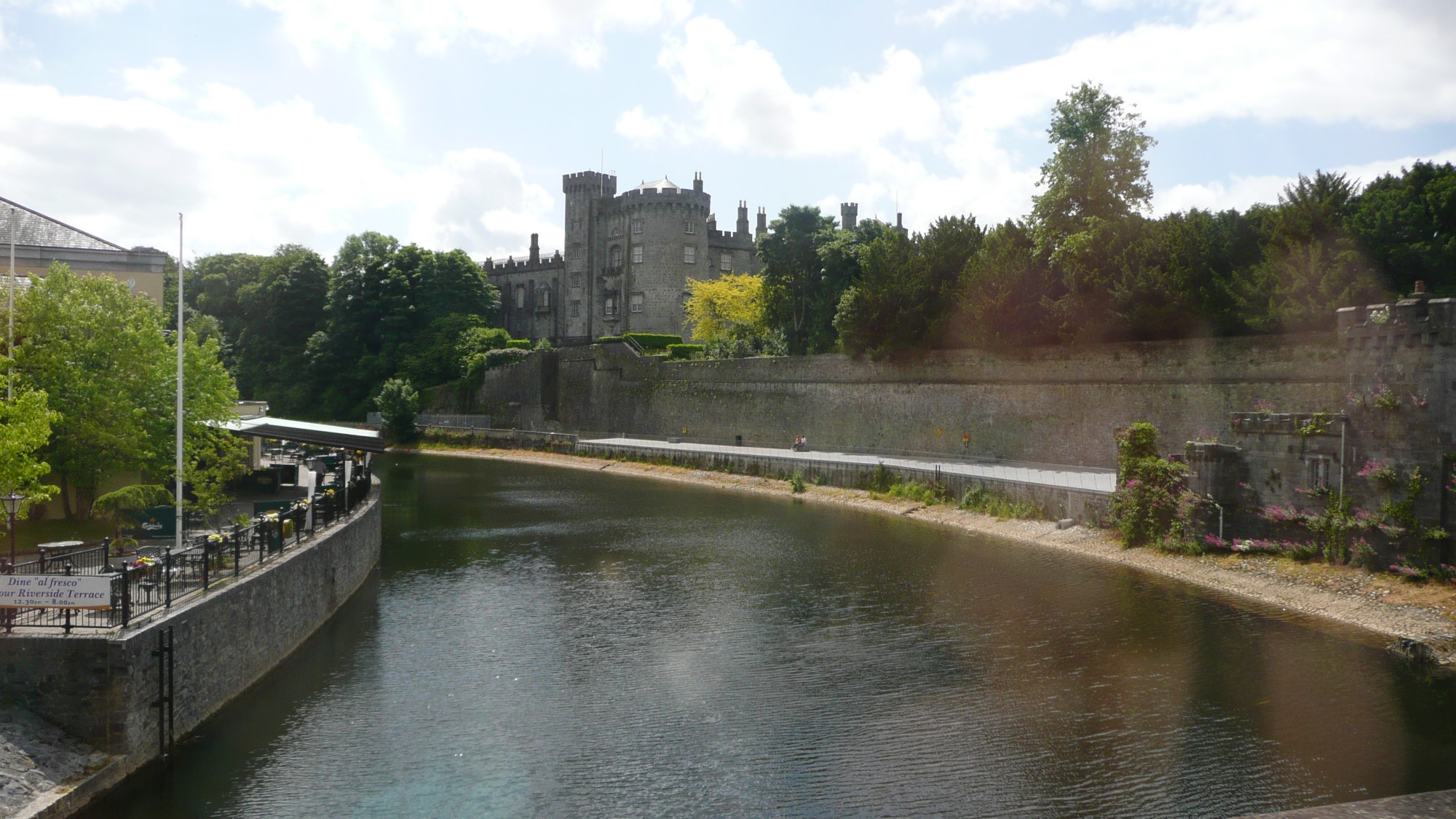 Killkenny Castle sitting on the shore of the River Nore.