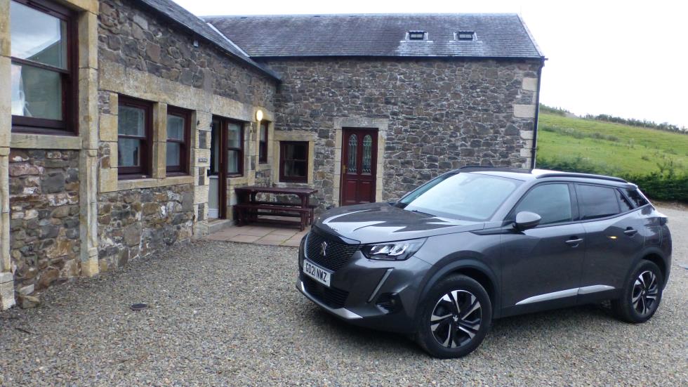 The entrance to our cottage with our Peugeot rental.