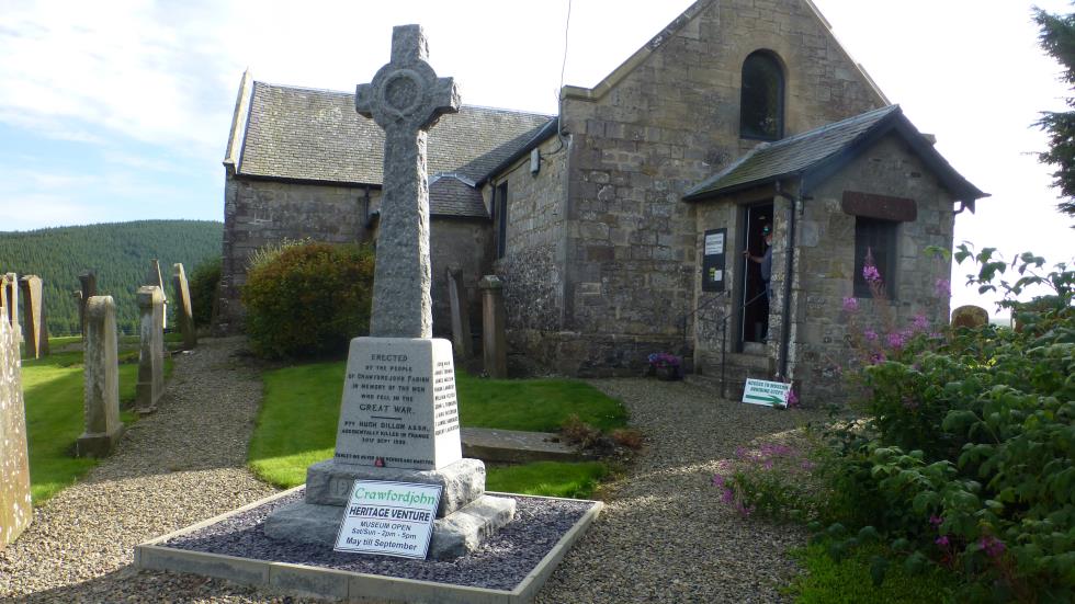 The Crawfordjohn Heritage Center with the War Memorial in the foreground.