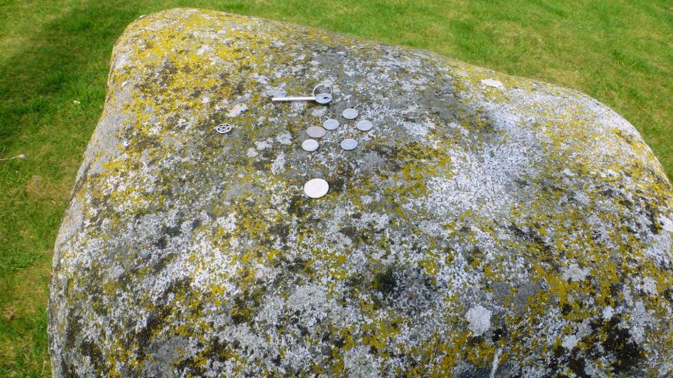 On one of the center stones, tokens had been left to secure safe passage.