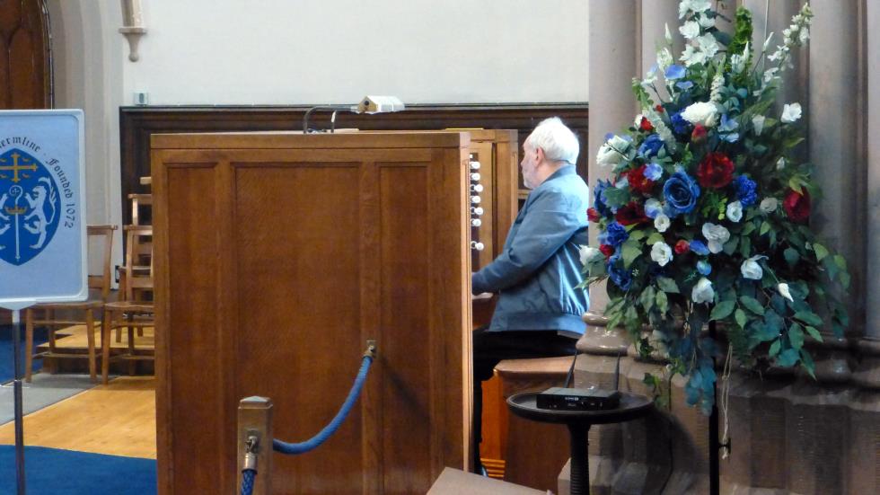 The organist playing "All You Need is Love".