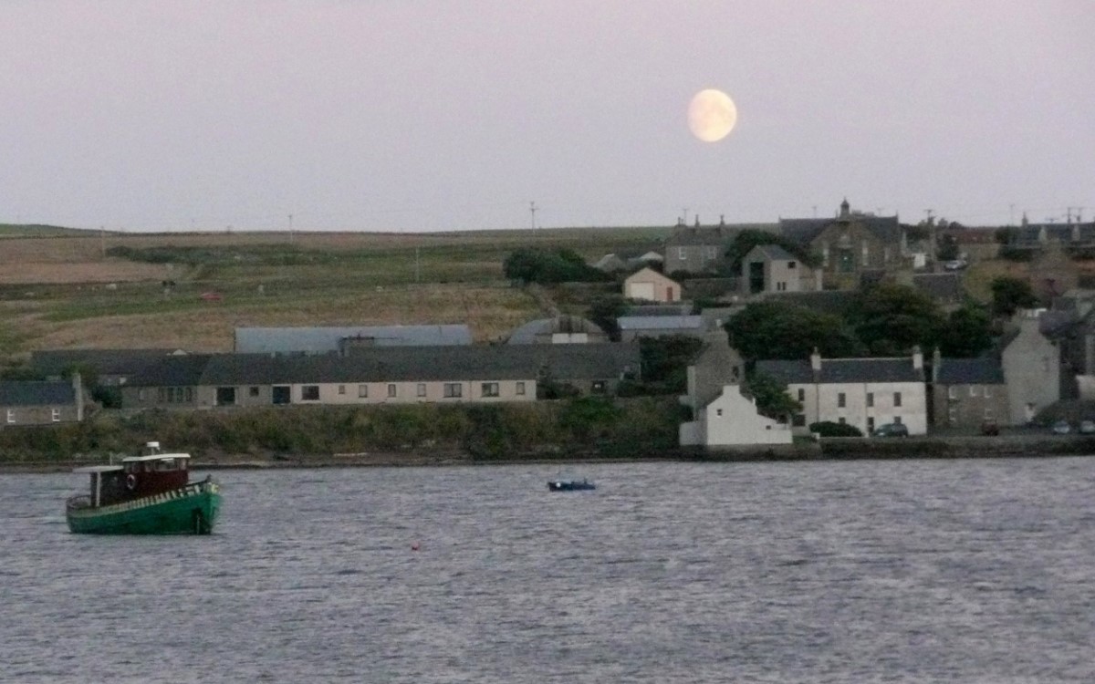 The waxing gibbous moon rising over St. Margaret's Hope