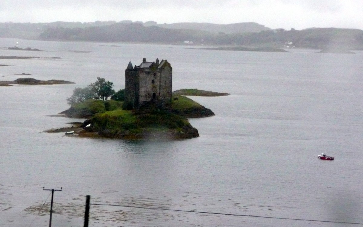 As we travel north on the A828, below us we see Castle Stalker guarding the head of Appin Bay