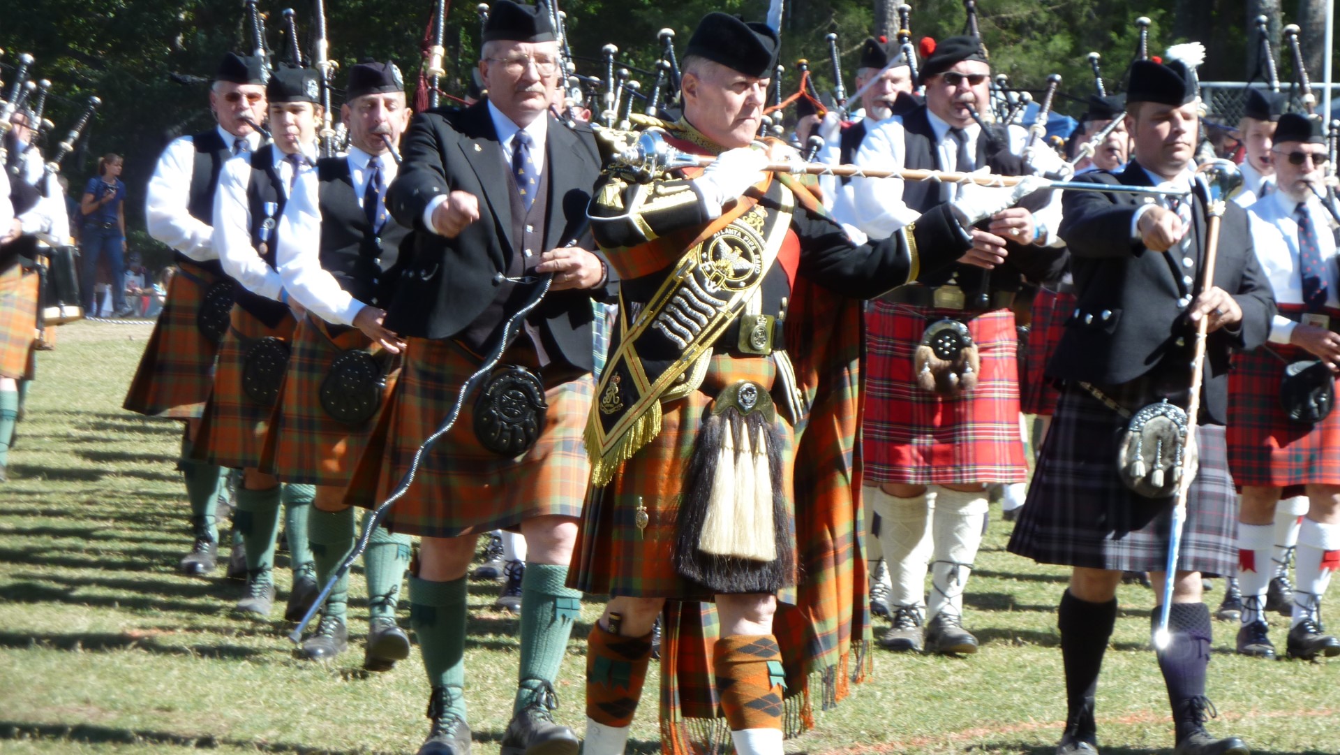 Jim Thompson leads the massed bands at the closing ceremonies.