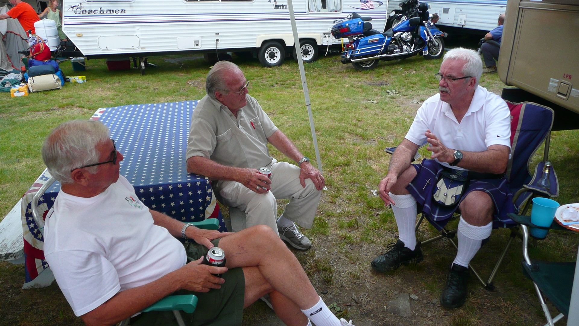 Alex, Bill Eisenhower and Bob Campbell shoot a little breeze.